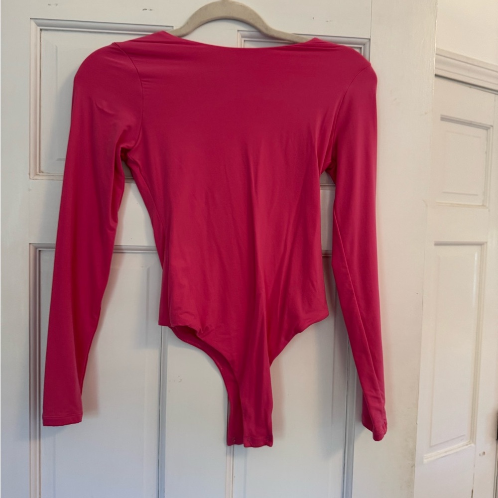 Pink body suit in size small.